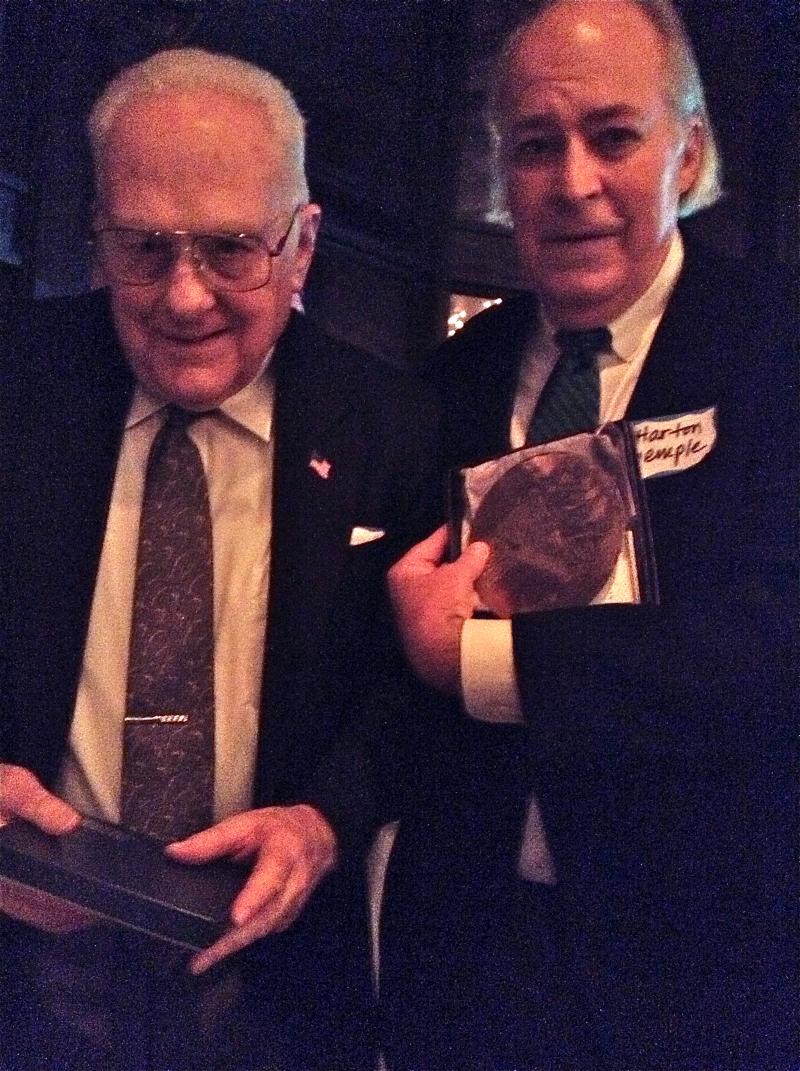 IMG_0954.61121544_std The Director of the Sewickley Historical Society, Harton Semple, (right) rewards Ron Potter (left) with a SVHS Wendell August Forge plaque of the Sewickley Bridge for his historic photographs that added so much to the evening.